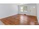 Bright living room featuring hardwood floors, neutral paint, a ceiling fan and natural light at 2515 Danforth Ln, Charlotte, NC 28208
