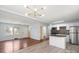 Open-concept living space featuring hardwood floors, a modern kitchen, and natural light at 2515 Danforth Ln, Charlotte, NC 28208