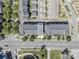 Aerial view showcases the townhouse among neighboring homes, tree-lined streets, and visible roadways at 2551 Statesville Ave, Charlotte, NC 28206