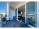 Inviting outdoor seating on balcony with views into the house with a fireplace at 2551 Statesville Ave, Charlotte, NC 28206