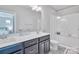 Stylish bathroom with dual vanity, granite countertop, and a glass-enclosed shower at 2551 Statesville Ave, Charlotte, NC 28206