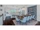 Open-concept living showcasing dining area flowing into a modern kitchen with a breakfast bar at 2551 Statesville Ave, Charlotte, NC 28206