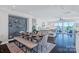 Bright dining room and living room with a modern open floor plan and access to a large outdoor patio at 2551 Statesville Ave, Charlotte, NC 28206