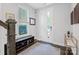 Inviting entryway featuring a shoe rack, coat hooks, and a light-filled window at 2551 Statesville Ave, Charlotte, NC 28206