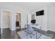 Home office with hardwood floors, a nearby bathroom, and plenty of natural light at 2551 Statesville Ave, Charlotte, NC 28206