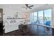 Open living room with a plush sofa and a sliding glass door to a balcony at 2551 Statesville Ave, Charlotte, NC 28206