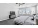 Bright and airy bedroom featuring a ceiling fan, multiple windows, and neutral decor at 2551 Statesville Ave, Charlotte, NC 28206