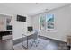 Bright office space with dark wood floors, a work station, and natural light at 2551 Statesville Ave, Charlotte, NC 28206