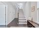 Bright and airy staircase with dark wood trim and white risers in a modern townhome at 2551 Statesville Ave, Charlotte, NC 28206