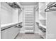 Functional walk-in closet with ample shelving and hanging space to maximize storage and organization at 2551 Statesville Ave, Charlotte, NC 28206