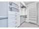 Spacious walk-in closet featuring custom shelves, drawers, and hanging rods for optimal organization at 2551 Statesville Ave, Charlotte, NC 28206