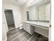 Open bathroom features granite counter, single vanity, toilet and tub/shower at 2815 Cartesian Dr, Charlotte, NC 28214