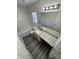 Bathroom featuring vinyl flooring, granite countertops, bathtub and shower combo, and a large mirror at 2815 Cartesian Dr, Charlotte, NC 28214