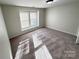 Inviting bedroom with neutral walls, carpet, and natural light streaming through the window at 2815 Cartesian Dr, Charlotte, NC 28214