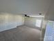 Bedroom with neutral walls, ceiling fan, carpet floors, and multiple windows with blinds at 2815 Cartesian Dr, Charlotte, NC 28214