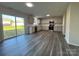 Open kitchen with stainless steel appliances, granite countertops, and luxury vinyl plank flooring at 2815 Cartesian Dr, Charlotte, NC 28214