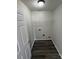 Laundry room with vinyl flooring, shelving, and washing machine hook ups at 2815 Cartesian Dr, Charlotte, NC 28214