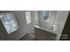 Bright staircase features carpeted steps and multiple windows allowing for ample natural light at 2815 Cartesian Dr, Charlotte, NC 28214