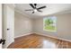 Sunlit bedroom boasts a large window and hardwood flooring at 2942 Denwood Dr, Claremont, NC 28610