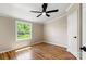 Bright bedroom with hardwood flooring and natural light from the window at 2942 Denwood Dr, Claremont, NC 28610