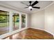 Cozy bedroom boasts hardwood floors and three large windows providing natural light at 2942 Denwood Dr, Claremont, NC 28610