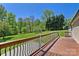 Deck overlooking large backyard with a view of the forest at 2942 Denwood Dr, Claremont, NC 28610