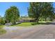 Charming single-story home with a covered front porch and lush green lawn at 2942 Denwood Dr, Claremont, NC 28610