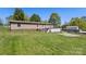 Back of house with deck and back yard view at 2942 Denwood Dr, Claremont, NC 28610