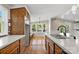 Bright kitchen area boasts stainless steel sink, ample cabinets, and views of the backyard at 2942 Denwood Dr, Claremont, NC 28610