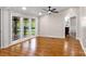 Bright living area features hardwood floors and large windows showcasing the wooded backyard at 2942 Denwood Dr, Claremont, NC 28610