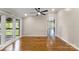 Relaxing living area features gleaming hardwood floors and big windows overlooking the backyard at 2942 Denwood Dr, Claremont, NC 28610