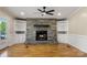 Cozy living room with stone fireplace and built-in bookshelves at 2942 Denwood Dr, Claremont, NC 28610