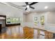 Bright and airy living room features hardwood floors and a view of the back deck at 2942 Denwood Dr, Claremont, NC 28610