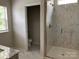 Elegant bathroom featuring a spacious glass shower with marble-style tile and modern fixtures at 3019 Glenn Hope Way, Matthews, NC 28104