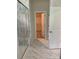 Well-lit bathroom showcasing a glass shower, marble-style tile flooring, and access to a walk-in closet at 3019 Glenn Hope Way, Matthews, NC 28104
