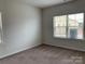 Bright bedroom featuring natural light with carpet floors and neutral color scheme at 3019 Glenn Hope Way, Matthews, NC 28104