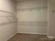 Spacious walk-in closet with carpeted flooring and multiple levels of wire shelving for ample storage at 3019 Glenn Hope Way, Matthews, NC 28104