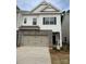 Charming two-story home featuring a stone front and attached two-car garage at 3019 Glenn Hope Way, Matthews, NC 28104