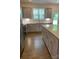 Modern kitchen featuring granite countertops, gray cabinets, and stainless steel appliances at 3019 Glenn Hope Way, Matthews, NC 28104