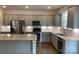 Well-lit kitchen with stainless steel appliances and ample counter space at 3019 Glenn Hope Way, Matthews, NC 28104
