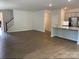 Open-concept living room with hardwood floors and a staircase to the left at 3019 Glenn Hope Way, Matthews, NC 28104