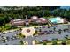 This aerial captures a clubhouse, pool, and parking, highlighting community amenities and lush landscaping at 3040 Azalea Dr, Indian Land, SC 29707