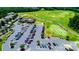 Aerial view of the community golf course and country club featuring manicured greens and tree-lined fairways at 3040 Azalea Dr, Indian Land, SC 29707