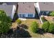 Aerial view of the backyard featuring a well-manicured lawn and privacy from mature trees for serene outdoor enjoyment at 3040 Azalea Dr, Indian Land, SC 29707
