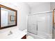 Bathroom with enclosed shower, framed mirrors and modern fixtures at 3040 Azalea Dr, Indian Land, SC 29707