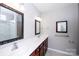 Bathroom featuring double sinks, modern fixtures, and framed mirrors at 3040 Azalea Dr, Indian Land, SC 29707