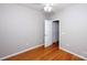 Bedroom with hardwood floors and a ceiling fan, with view through the open door at 3040 Azalea Dr, Indian Land, SC 29707