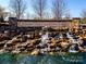 Beautiful stone waterfall feature at the entrance to Sun City Carolina Lakes by Del Webb at 3040 Azalea Dr, Indian Land, SC 29707