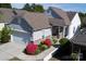 Inviting home featuring a manicured lawn and vibrant landscaping enhancing the appeal of this stunning property at 3040 Azalea Dr, Indian Land, SC 29707