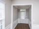 Bright foyer features neutral walls, chair rail molding, and tile flooring at 3040 Azalea Dr, Indian Land, SC 29707